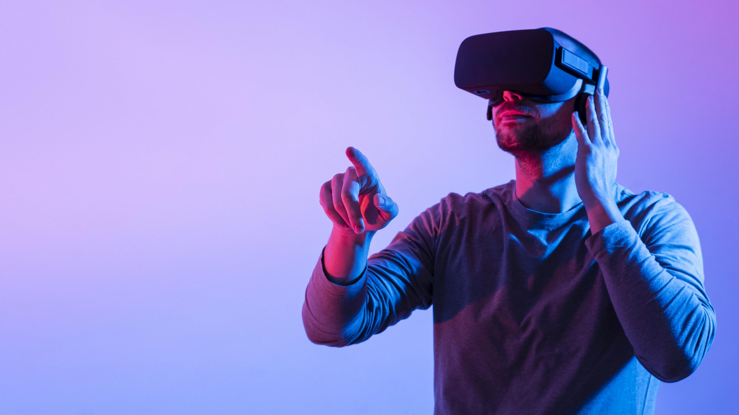 Man wearing a virtual reality headset and experiencing the metaverse